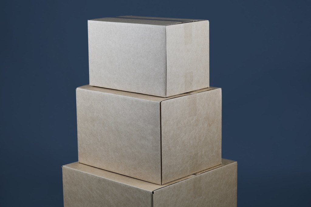 Three cardboard moving boxes